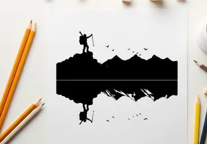 Silhouette of a hiker on a mountain peak at sunrise