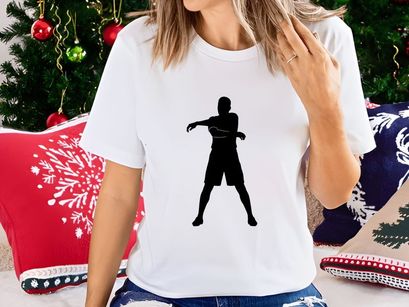A person in a dynamic stance with arms outstretched in a black silhouette