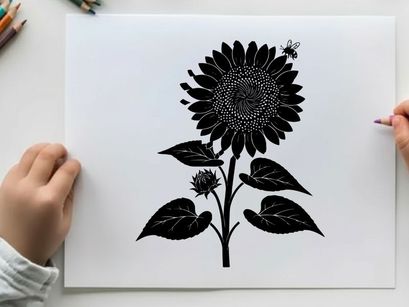 Silhouette of a large sunflower with leaves and small bloom