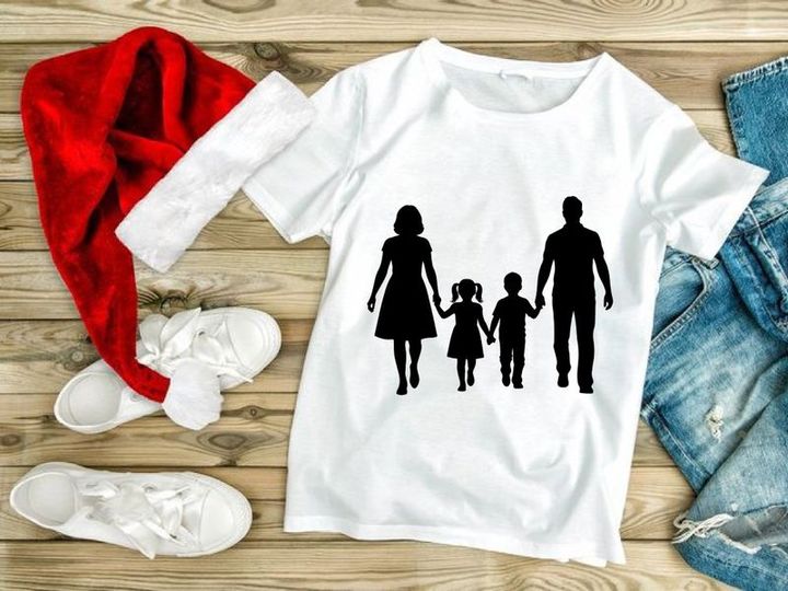 Happy family holding hands walking together silhouette outdoor