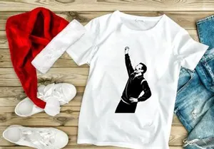 A man in a tracksuit throwing his fist up in the air with excitement or defiance