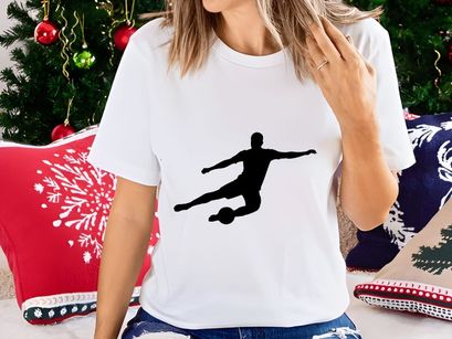Soccer player kicking a ball in mid air motion silhouette