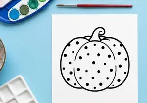 Hand-drawn Halloween pumpkin illustration with polka dots. Whimsical jack-o-lantern doodle for festive seasonal decor and crafts.