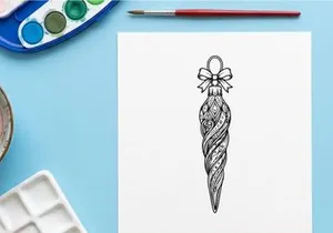 Christmas tree ornament bauble with intricate patterns and a decorative bow