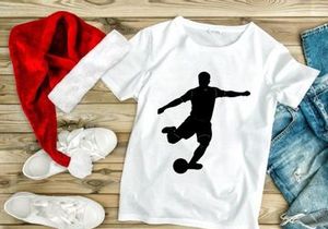 Soccer player kicking a ball in motion