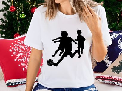 Children playing soccer silhouette