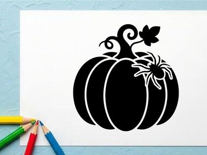 Silhouette of a pumpkin with a spider and leaf for Halloween decor