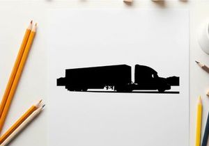Silhouette of a semi truck driving on the road with mountains