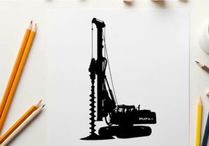 Silhouette of a large drilling machine with a long screw drill