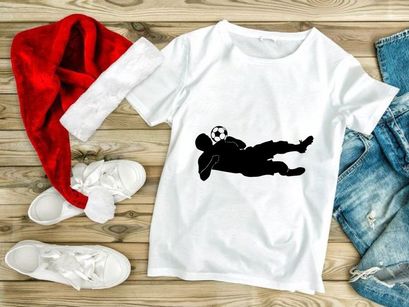 Soccer goalkeeper diving to save a ball in a match