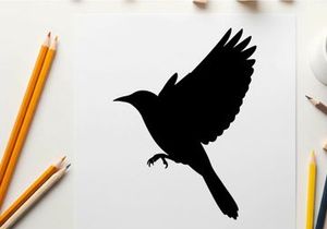 Silhouette of a bird in mid flight with wings spread wide