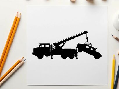 Silhouette of a tow truck lifting a car with a crane