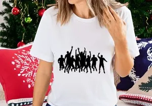 Silhouette of a group of people jumping and celebrating together in unison