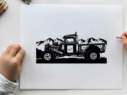 Vintage truck silhouette against majestic mountains