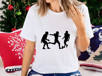 Silhouette of three soccer players in action on the field