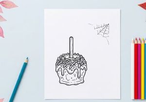 Halloween candy apple coloring page. Spooky caramel apple line art for kids activity.