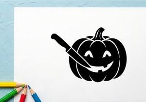 Cute Halloween Pumpkin with Carving and Candlelight
