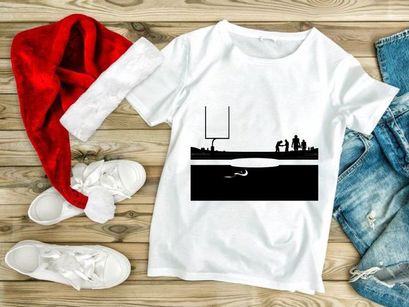 American football players on a field with goal post at dusk or dawn