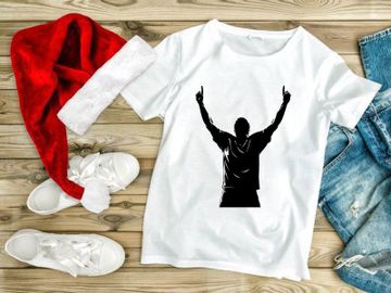 A man in a triumphant pose with arms raised high in the air preview picture