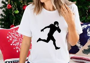 American football player running with ball in hand silhouette