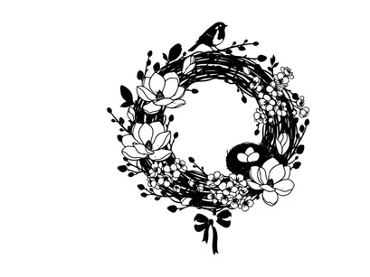 Silhouette of a bird on a floral wreath decoration