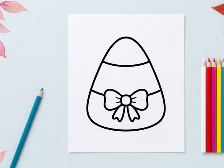 Candy corn icon with a bow. Minimalist Halloween candy vector illustration.