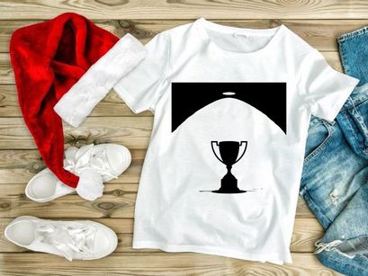 A shining spotlight on a classic trophy cup in a dark room