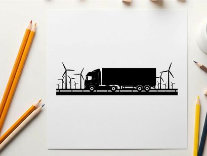 Truck silhouette driving past wind turbines on a sunny day