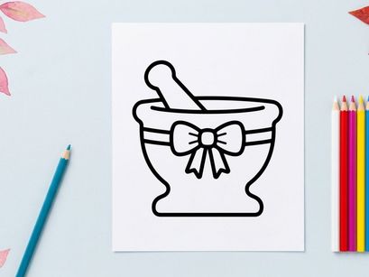 Mortar and pestle with decorative bow for herbal remedies. Classic apothecary tool used in natural medicine and wellness preparation.