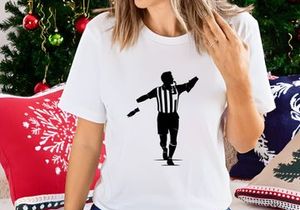 Soccer referee in motion signaling a call