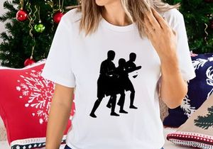Three silhouetted men in traditional dance or martial arts movement