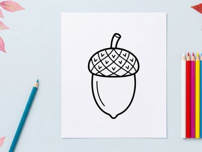 Close-up of an acorn with textured cap and smooth nut. Natural autumn theme for educational or nature-related projects.