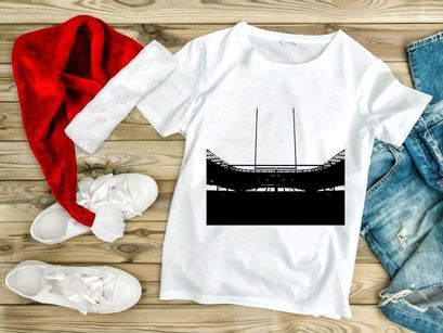 A black and white photo of a rugby goal post in a stadium