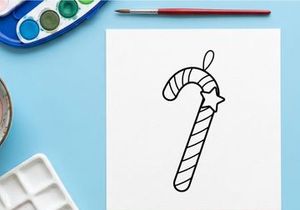 Hand-drawn candy cane with star and bow for festive Christmas holiday decoration