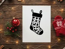 Black and white Christmas stocking icon with reindeer and snowflake pattern design