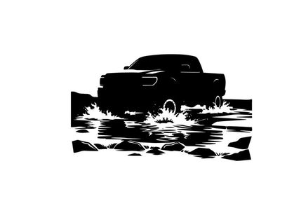 Silhouette of a pickup truck driving through water on a road
