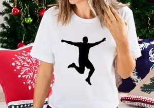 A person jumping in the air with arms outstretched in a celebratory pose silhouette