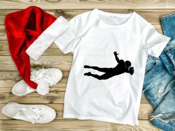 American football player diving to catch a ball in mid air preview picture