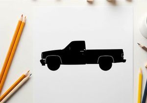 Silhouette of a classic pickup truck against a white background