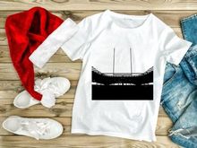 A black and white photo of a rugby goal post in a stadium