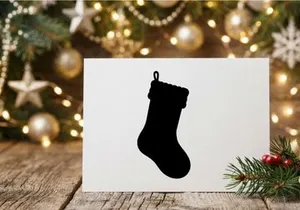 Black silhouette of a Christmas stocking isolated on a white background