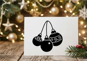 Festive Christmas ornaments hanging on string for holiday decoration