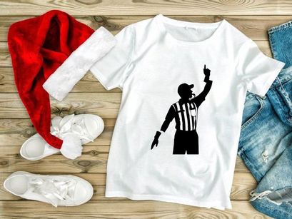 A black silhouette of a referee signaling a penalty in a sporting event