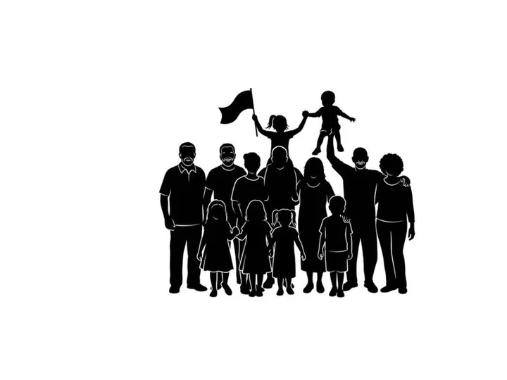Silhouette of a diverse family with a child on father's shoulders waving a flag