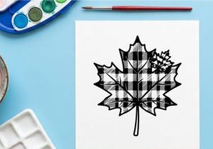 Decorative maple leaf with plaid pattern for seasonal design. Autumn-inspired graphic with rustic charm.