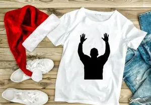 A silhouette of a man with his hands raised up in the air in celebration or triumph