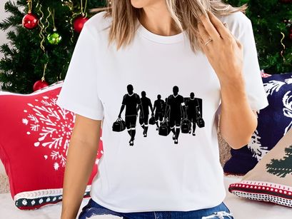 Silhouette of soccer players walking with sports equipment