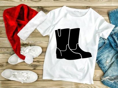 Black suede ankle boots with white stitching isolated on white