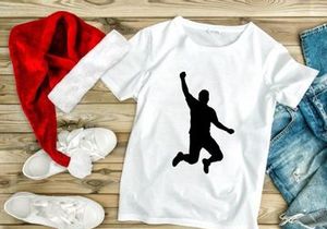 A silhouette of a person jumping in the air with one arm raised