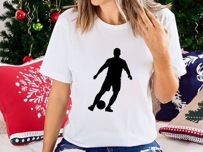 Soccer player kicking a ball in action